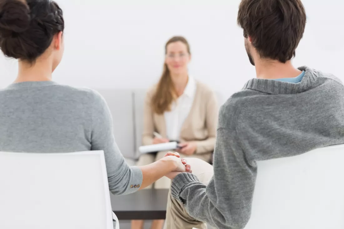 blurred-financial-adviser-meeting-with-couple