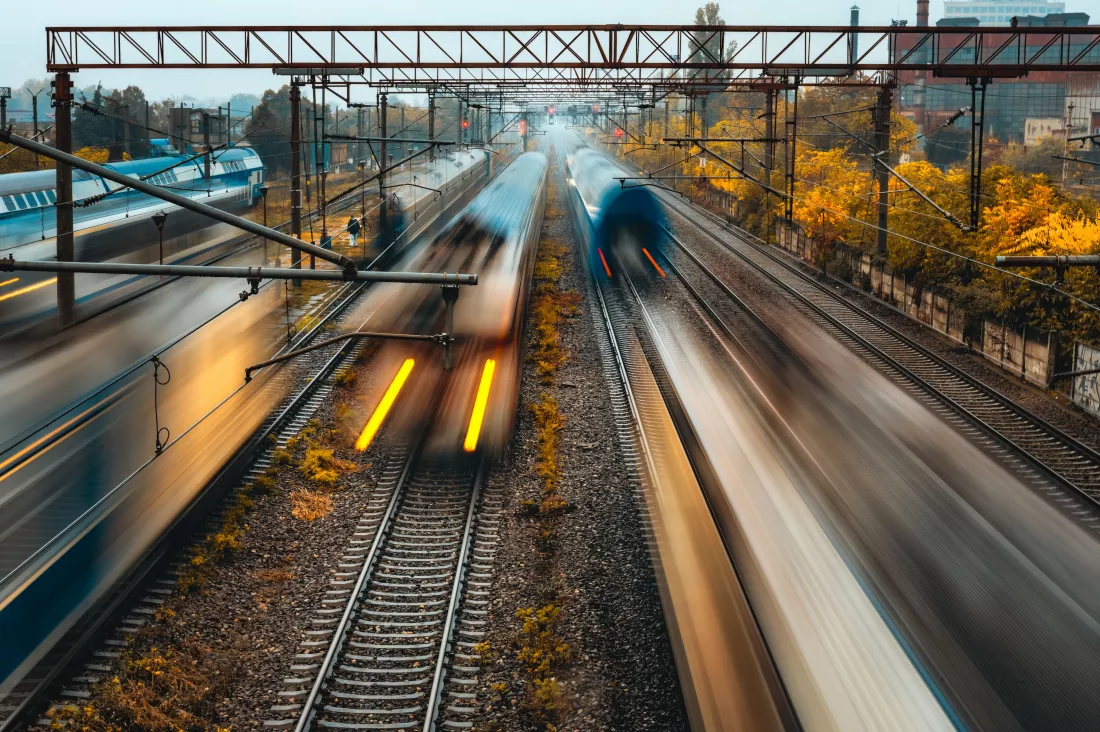 highangle-trains-passing-by-bucharest-railway-with-long-exposure-effect