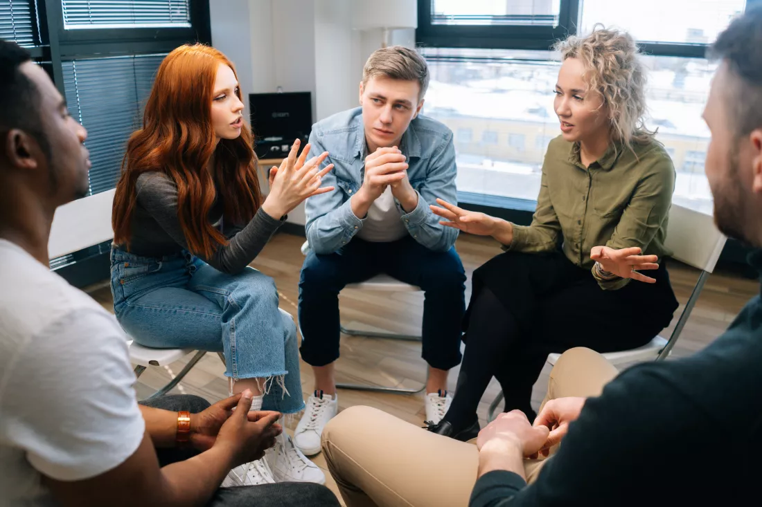 friendly-multiethnic-business-team-share-ideas-brainstorming-background-window-young-creative-colleagues-working-together-teamwork-discuss-project-plan-office