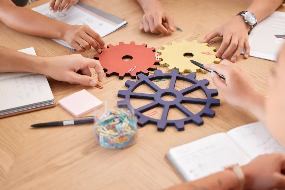 team-strategy-collaboration-gears-innovation-problem-solving-business-meeting-corporate-teamwork-planning-research-development-analysis-abstract-project-partnership-office-work-table